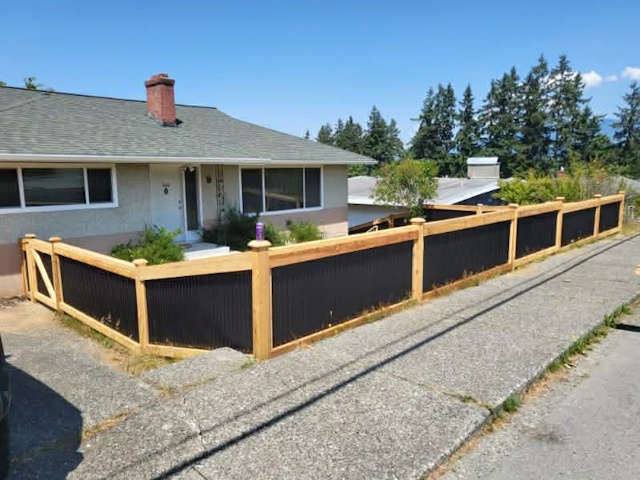 A fencing installation done by West Coast Fencing, displayed as a work sample.