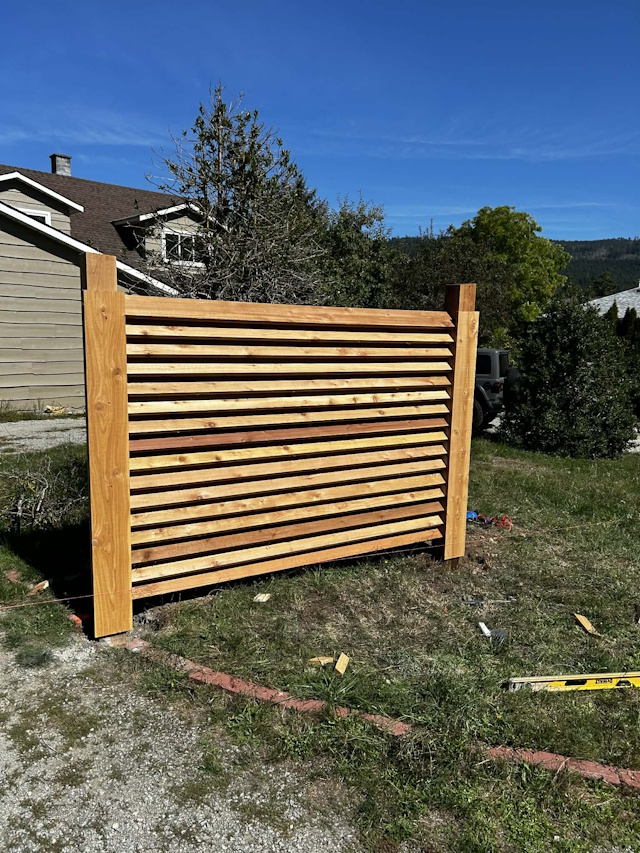 A fencing installation done by West Coast Fencing, displayed as a work sample.