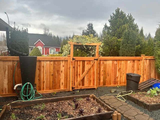 A fencing installation done by West Coast Fencing, displayed as a work sample.
