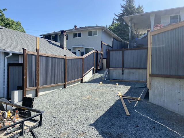 A fencing installation done by West Coast Fencing, displayed as a work sample.