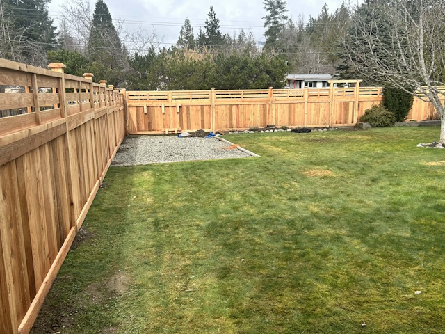 A fencing installation done by West Coast Fencing, displayed as a work sample.