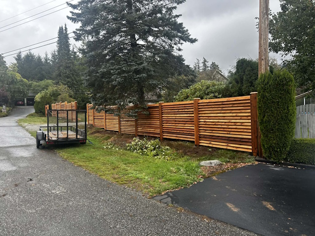A fencing installation done by West Coast Fencing, displayed as a work sample.
