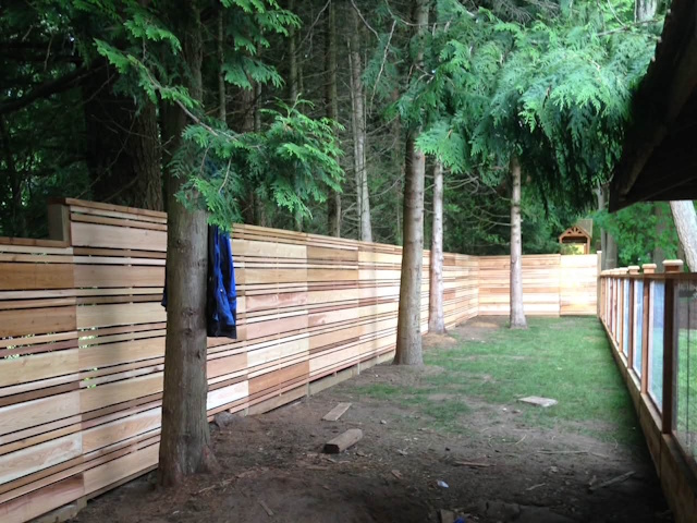 A fencing installation done by West Coast Fencing, displayed as a work sample.