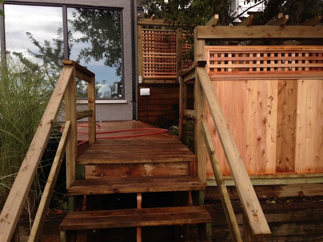 A fencing installation done by West Coast Fencing, displayed as a work sample.