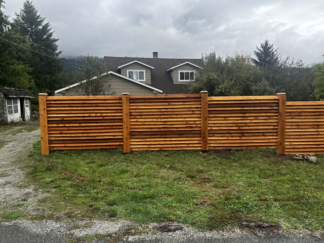 A fencing installation done by West Coast Fencing, displayed as a work sample.