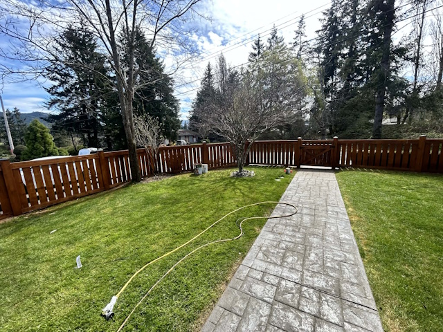 A fencing installation done by West Coast Fencing, displayed as a work sample.